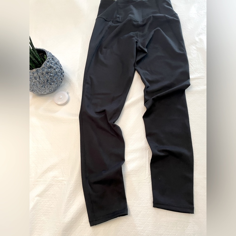 Marika size Black Medium 3/4 length leggings.  Back cell phone Pocket.